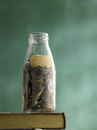 Close-up of coins in jar