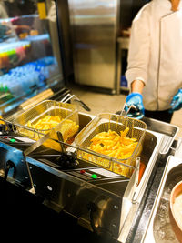 Midsection of man preparing food