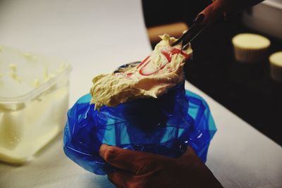 Cropped hand of person holding ice cream