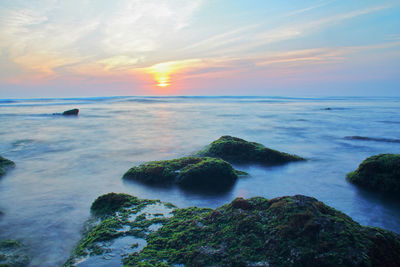 Scenic view of sea against sky during sunset