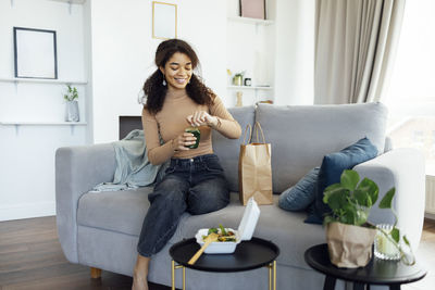 Young woman using laptop at home