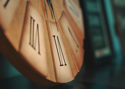 Close-up of clock on wood