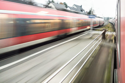 Blurred motion of train at railroad station