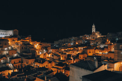 High angle shot of illuminated townscape against sky at night