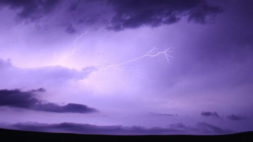 Lightning in sky at night