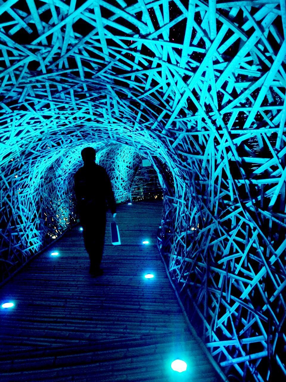 full length, lifestyles, rear view, leisure activity, walking, men, silhouette, boys, tunnel, person, illuminated, night, the way forward, togetherness, childhood, standing, indoors