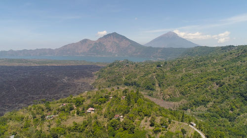 Aerial view volcano batur covered with vegetation mountain landscape with volcano sky and clouds