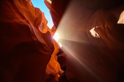 Low angle view of man standing on mountain