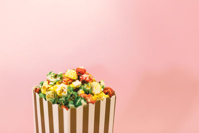 Close-up of multi colored candies against white background