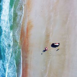 Aerial view of pick-up truck at beach on sunny day