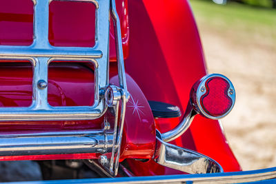 Close-up of red vintage car