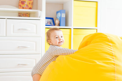 Portrait of smiling boy at home