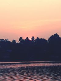 Scenic view of sea against orange sky