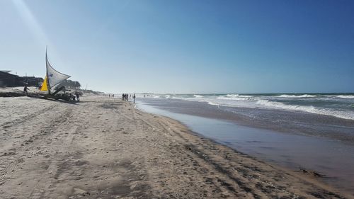 Scenic view of beach against clear sky