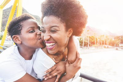 Boy kissing mother