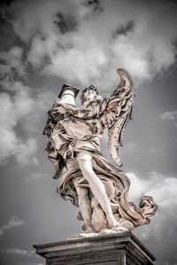 Low angle view of statue against sky