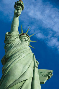 Low angle view of statue against blue sky