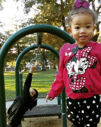 Portrait of happy girl playing in park