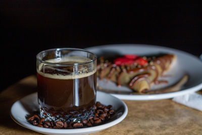 Close-up of coffee cup on table