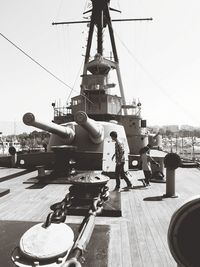 Man at harbor against sky