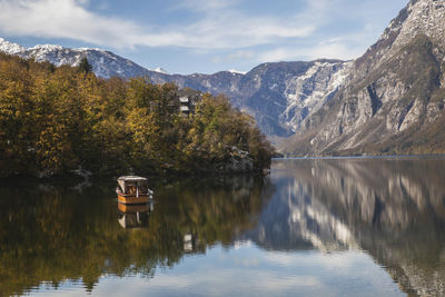 Picturesque lake bohinj which reflects the alps. triglav national park in slovenia in autumn