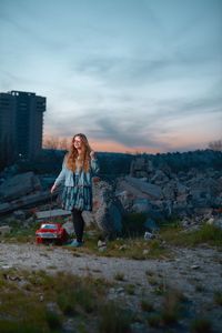 Full length of woman standing against sky