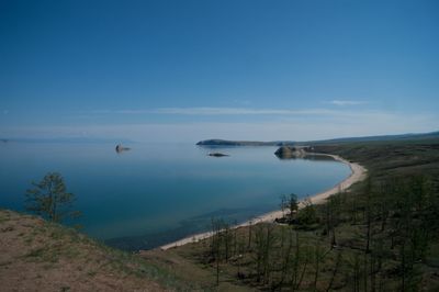 Scenic view of landscape against blue sky