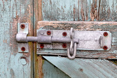 Close-up of closed latch of old door