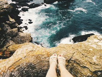 Low section of woman in sea