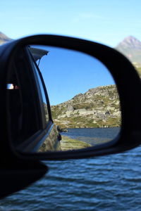 Reflection of sky on side-view mirror