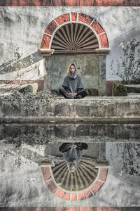 Woman meditating outdoors