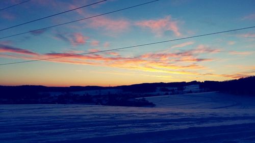 Scenic view of landscape against sky during sunset