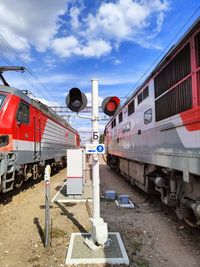 Train on railroad tracks against sky