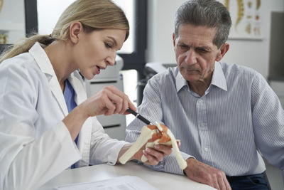 Doctor explaining treatment to patient at clinic