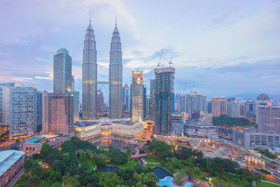 Petronas twin towers amidst modern buildings in city