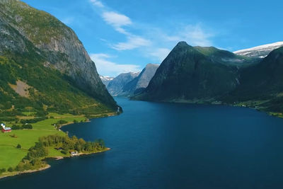 Scenic view of lake and mountains against sky