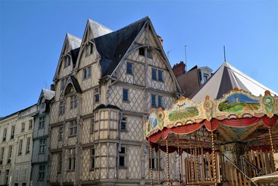 Low angle view of building against clear blue sky