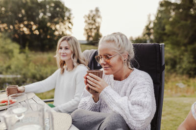 Women sitting on table at park