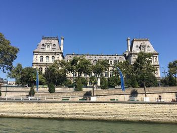 Low angle view of temple against clear blue sky