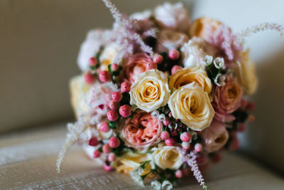Close-up of bouquet of roses in vase on table