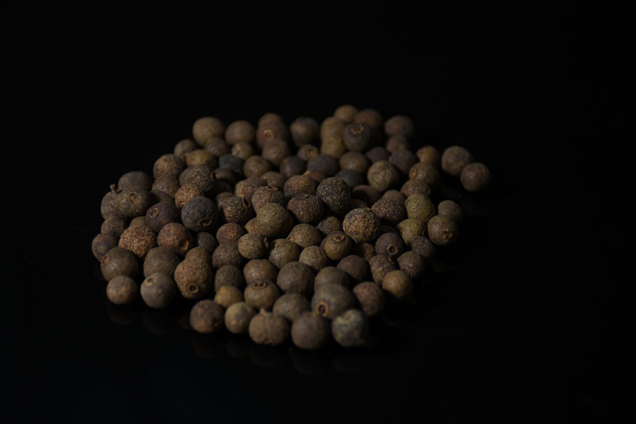 CLOSE-UP OF COFFEE BEANS ON TABLE