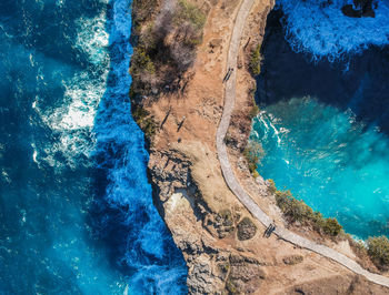 High angle view of rocks by sea