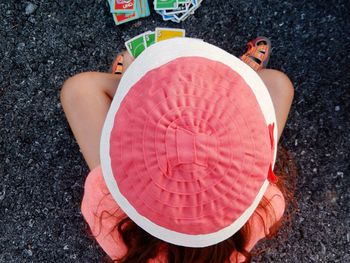 Portrait of young woman sitting on wall