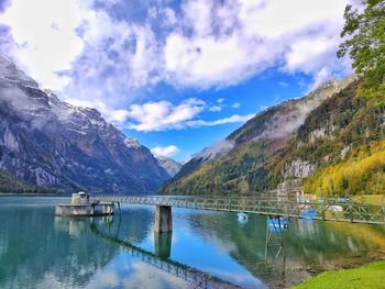 Scenic view of lake and mountains against sky