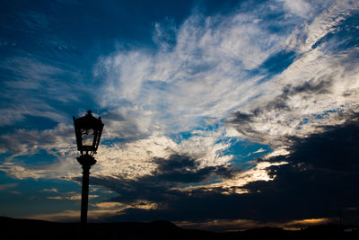 Low angle view of street light against sky