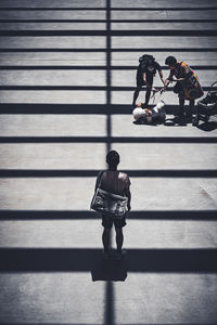 Rear view of woman walking on steps