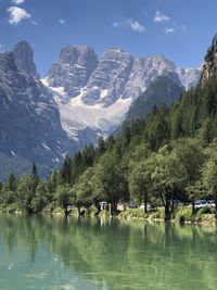 Scenic view of lake and mountains against sky