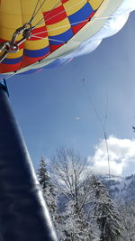 Low angle view of flags against sky during winter