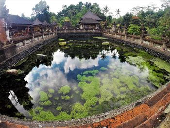 Reflection of buildings and trees in lake