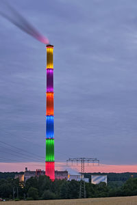 Low angle view of illuminated building against sky at dusk